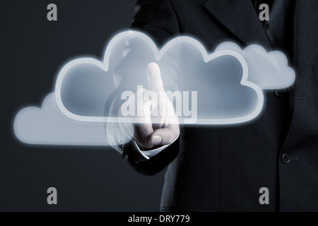 Businessman activating cloud symbol on futuristic touch display Stock Photo