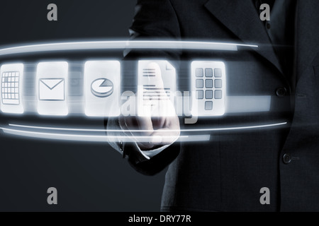Businessman navigating documents on futuristic touchscreen Stock Photo