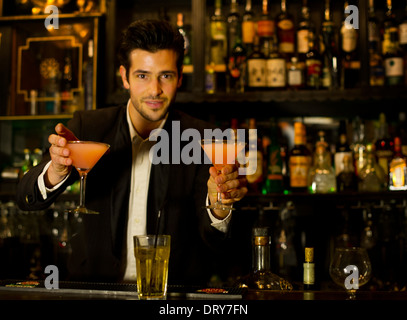 Bartender serving cocktails Stock Photo