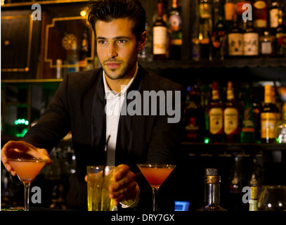 Bartender serving cocktails Stock Photo