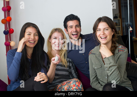 Friends watching movie at home together