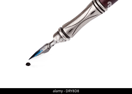 Old fashioned ink pen with drop of ink isolated on white background Stock Photo