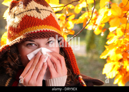woman with handkerchief in autumn Stock Photo