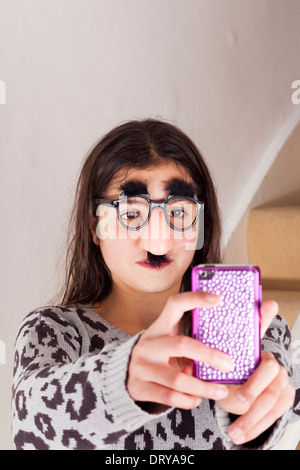 funny teenage girl taking selfie and making faces Stock Photo - Alamy