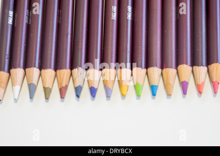 Row of coloured pencil crayon tips on white background Stock Photo