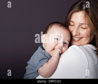 Portrait of a mother with her baby,studio shot Stock Photo
