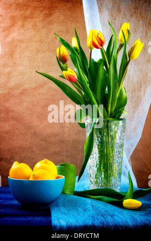 Still life with a bouquet of tulips and lemons Stock Photo - Alamy