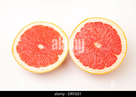 Sliced ruby red grapefruit on white background Stock Photo