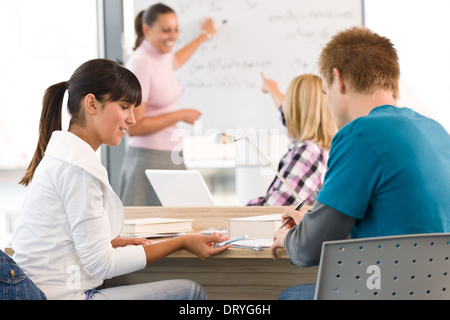 High school students with professor in classroom studying Stock Photo ...
