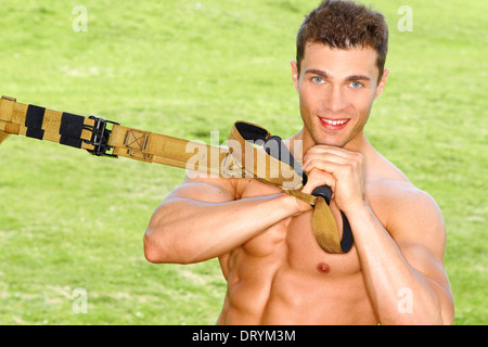 Handsome man doing exercises Stock Photo