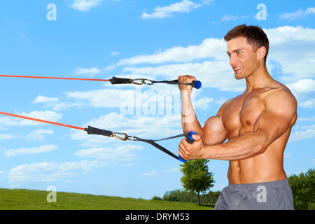 Handsome man doing exercises Stock Photo
