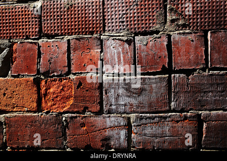 Damaged brick wall Stock Photo