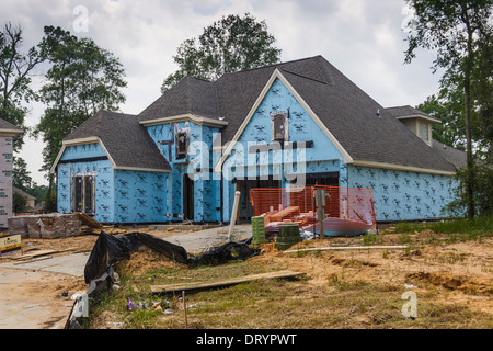 Unfinished new custom two-story home under construction Stock Photo
