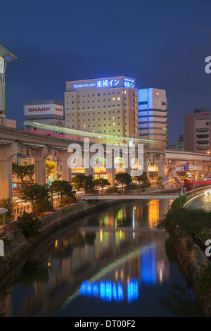 Asahibashi monorail station and downtown Naha at dusk, Okinawa, Japan Stock Photo