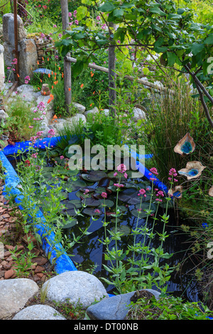 Blue pond in a garden, France, the 'Garden of Sambucs' (Obligatory mention of the garden’s name. Only use for press and books) Stock Photo