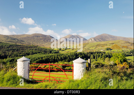 The Mourne Mountains, County Down, Northern Ireland. South over the Trassey Valley and Tollymore Forest Park to Slieve Bearnagh Stock Photo