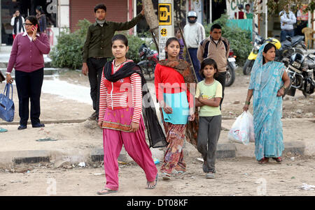 New Delhi, India. 05th Feb, 2014. People await the arrival of the German President in New Delhi, India, 05 February 2014. President Gauck is in India on his six days official visit to strengthen the political and business ties between the two countries. Photo: WOLFGANG KUMM/dpa/Alamy Live News Stock Photo