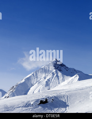 Ski slope in sun nice day. Georgia, ski resort Gudauri. Caucasus Mountains. Stock Photo