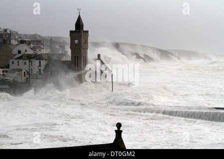 Giant waves crash against Porthleven causing damage to buildings and sinking at least four boats in the harbor. Cornwall 5/2/14 Stock Photo