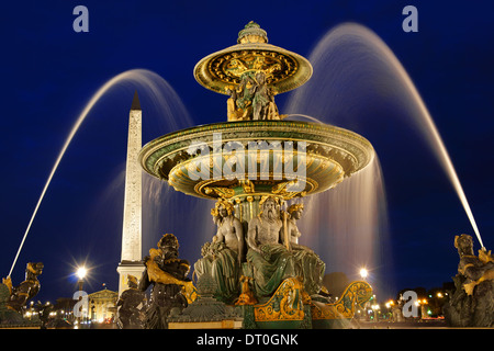 The rivers fountain (Fontaine des Fleuves) in Place de la Concorde by night in Paris, France. Selective focus. Stock Photo