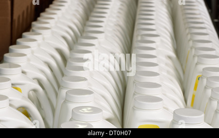 Bottles lined up for boxing in a manufacturing facility Stock Photo