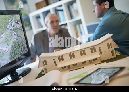 Woodstock New York USA Architects working on construction project model Stock Photo