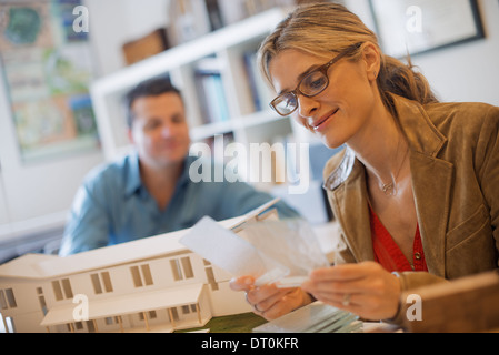 Woodstock New York USA Two people working on green construction project computer Stock Photo