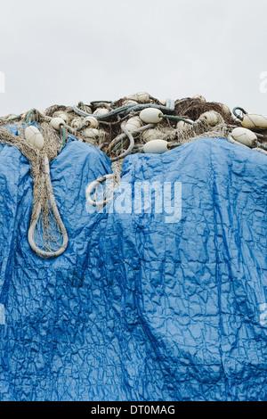 Seattle Washington USA blue tarpaulin covering commercial fishing nets Stock Photo