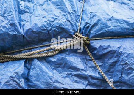 Seattle Washington USA blue tarpaulin covering commercial fishing nets Stock Photo