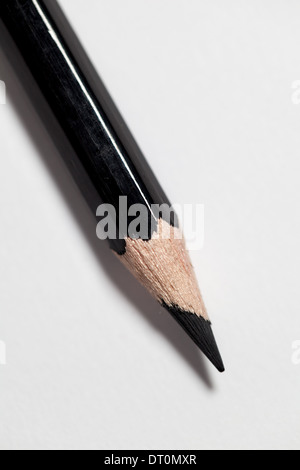 A coloured pencil on a white paper background. Stock Photo