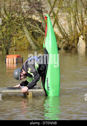 members of the isis  canoe club makeing the best of the flooding  at port meadow oxford Flooding at port meadow oxford 25/11/12 Stock Photo