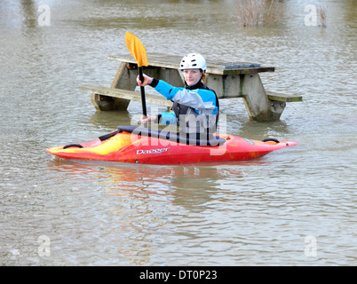 members of the isis  canoe club makeing the best of the flooding  at port meadow oxford Flooding at port meadow oxford 25/11/12 Stock Photo