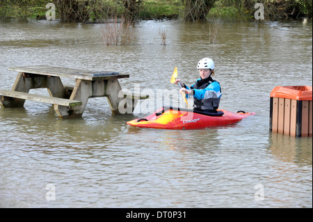 members of the isis  canoe club makeing the best of the flooding  at port meadow oxford Flooding at port meadow oxford 25/11/12 Stock Photo