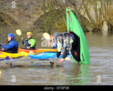 members of the isis  canoe club makeing the best of the flooding  at port meadow oxford Flooding at port meadow oxford 25/11/12 Stock Photo