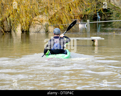 members of the isis  canoe club makeing the best of the flooding  at port meadow oxford Flooding at port meadow oxford 25/11/12 Stock Photo