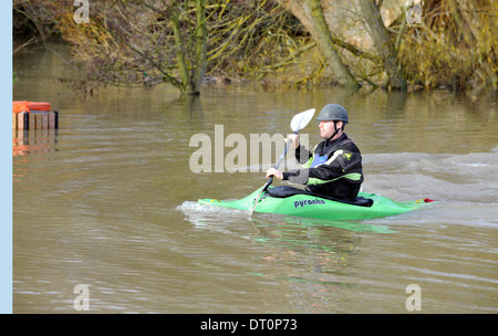 members of the isis  canoe club makeing the best of the flooding  at port meadow oxford Flooding at port meadow oxford 25/11/12 Stock Photo