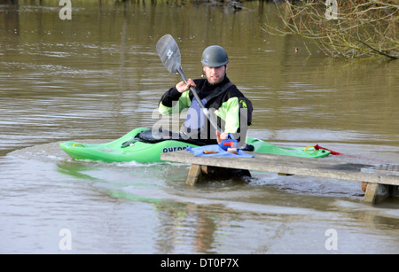 members of the isis  canoe club makeing the best of the flooding  at port meadow oxford Flooding at port meadow oxford 25/11/12 Stock Photo