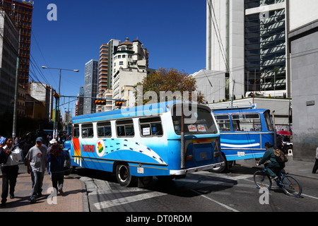 Vintage buses block the main Av 16 de Julio road through the city centre during a strike by public transport unions, La Paz, Bolivia Stock Photo