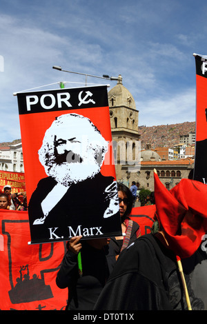 A members of the Revolutionary Workers Party carries a picture of Karl Marx during a protest march on Labour Day May 1st, La Paz, Bolivia Stock Photo