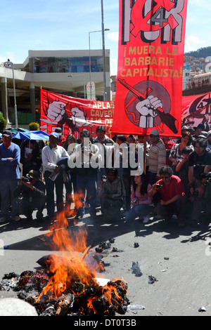 Members of the Revolutionary Workers Party (POR) burn an effigy during a protest march on Labour Day May 1st, La Paz, Bolivia Stock Photo