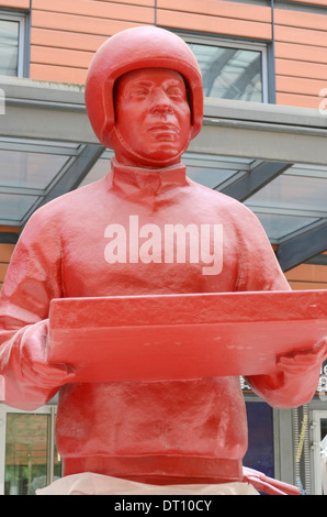 Statue of a red pizza delivery man, cité internationale, The International City, Lyon, France Stock Photo