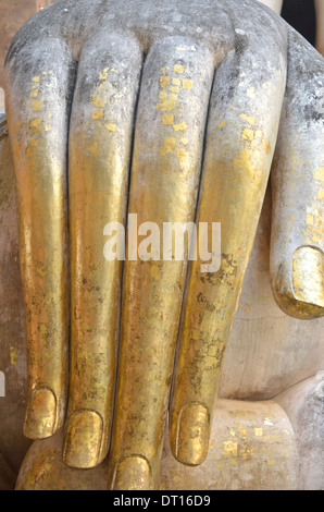 Close-up of golden hand detail of Giant Buddha, Wat Sri Chum, Sukhothai Historical Park, Thailand