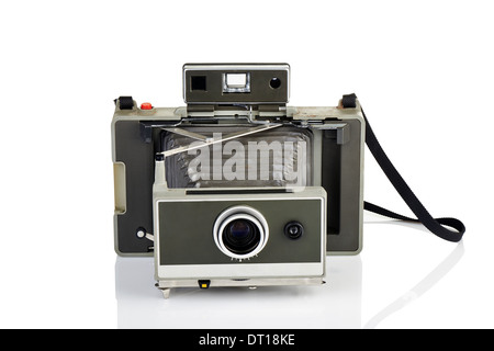 Vintage instant camera and his reflection on white background Stock Photo