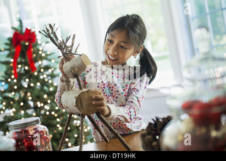Woodstock New York USA twig figure reindeer making Christmas decorations Stock Photo