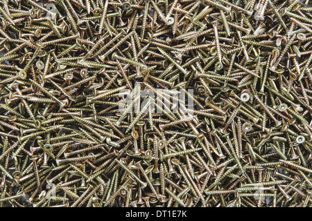 pile of brass screws with screw thread Stock Photo
