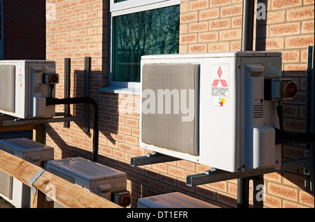 Air aircon conditioning units unit outside building England UK United Kingdom GB Great Britain Stock Photo