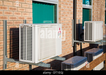 Air conditioning aircon units unit outside building England UK United Kingdom GB Great Britain Stock Photo