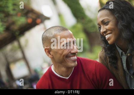 Scenes from urban life in New York City A man and a woman a couple Looking at each other Outdoors Stock Photo