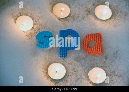 Spa letters with candles abstract Stock Photo