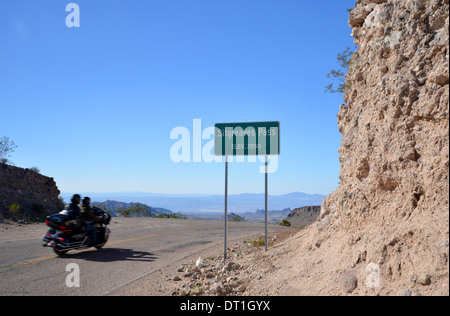 Motorbike passes the top of the Sitgreaves Pass, high in the mountains near Las Vegas, along old Route 66 through Arizona Stock Photo